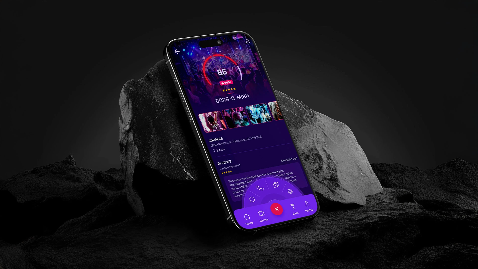 Vannify nightlife app on an iPhone resting on a rock